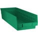 a green plastic bin with a white background