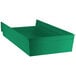 a green shelf in a room