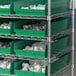 Metal shelving with Regency green shelf bins.