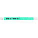 A green Carnival King wristband with the words "OVER 21" in black.