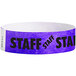 A purple Carnival King wristband with black "STAFF" text.