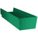 A green plastic Regency shelf bin with two compartments.