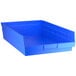 A blue plastic Regency shelf bin.