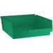 A green plastic rectangular shelf bin.