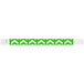A neon green wristband with white arrows pointing up.