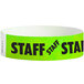 A green Carnival King paper wristband with black "STAFF" text.