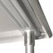 A metal mixer table with a stainless steel pole underneath.