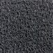 A close-up of a grey unbacked scraper mat with black rings.