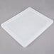 A Vollrath stainless steel flexible steam table pan lid on a white plastic tray.