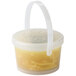 A close-up of a clear plastic container with a plastic handle.