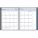 a spiral bound calendar with days of the week