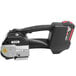 A black and silver PAC Strapping heavy duty battery powered strapping tool with a handle.
