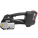 A black and silver PAC Strapping heavy duty battery powered strapping tool with a handle.