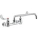 A Waterloo wall-mounted faucet with wrist handles and a swing spout over a white background.