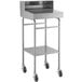 A silver metal Lavex receiving desk with wheels and a shelf.