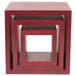 A stack of American Metalcraft mahogany wood display risers on a red surface with a white border.