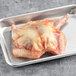 A raw Squab on a baking tray.