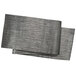 A close-up of a black woven vinyl table runner with a tweed pattern.