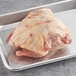 a raw chicken on a metal tray