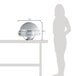 A woman using a Vollrath Somerville round drop-in chafer on a table outdoors.