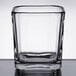 A clear square glass with a square edge.