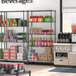 Regency black epoxy shelving with boxes and beverages on the shelves.