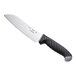 A Schraf Santoku knife with a black TPRGrip handle.