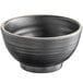 A black Acopa melamine bowl with an ivory rim.