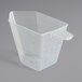 A clear plastic 8 oz. Polypropylene Measuring Cup with a handle.