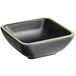 An Acopa Ugoki black square melamine sauce dish with ivory trim.