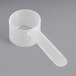 A white plastic measuring scoop with a long handle.