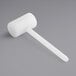 A white plastic meat tenderizer with a long handle.