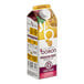 A carton of Les Vergers Boiron Passion Fruit puree on a table.