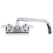 A chrome Equip by T&S wall mount faucet with 10 1/8" swing spout and lever handles.