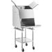 A stainless steel ServIt chip warmer machine with a lid open on a mobile stand.