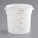 A white translucent round plastic food storage container with a lid and red writing on it.