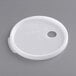 A white translucent plastic lid with a hole in it.