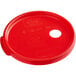 A red plastic lid with a hole for a condiment pump.
