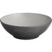 A close up of an Acopa melamine bowl with a white rim and grey and black interior.