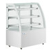 An Avantco white 3-shelf curved glass dry bakery display case.