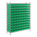 A large metal rack with green bins on each shelf.