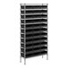 A Regency metal shelving unit with black bins on the shelves.