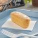 An individually wrapped Katz Gluten-Free Heavenly Vanilla Creme Cake on a blue plate.