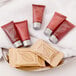 A tray of Ecossential Naturals shampoo bottles, cream, and body wash.