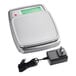 A stainless steel digital portion control scale with a power adapter.