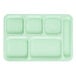 A close-up of a green rectangular Carlisle 6 compartment tray.
