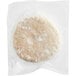 A Rastelli's all-natural turkey burger patty in a glass container.