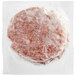 A frozen Rastelli's American Wagyu burger in plastic wrap.