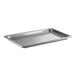A Vollrath stainless steel hotel pan with holes in it.