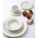 A Tuxton Monterey eggshell china plate with a red berry band.